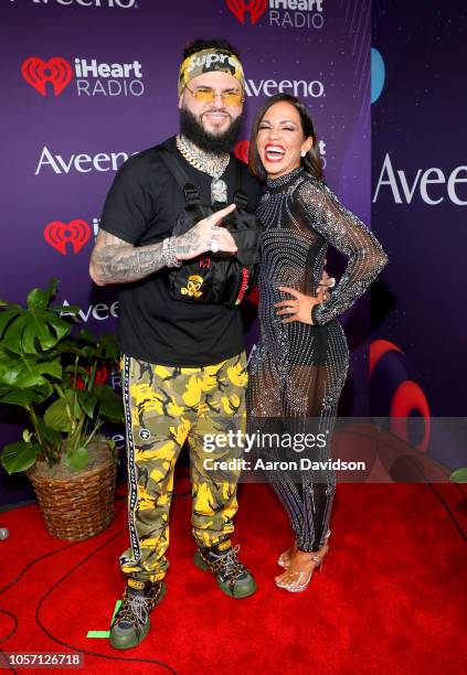 Farruko and Jenny Castillo attend iHeartRadio Fiesta Latina at AmericanAirlines Arena on November 3, 2018 in Miami, Florida.