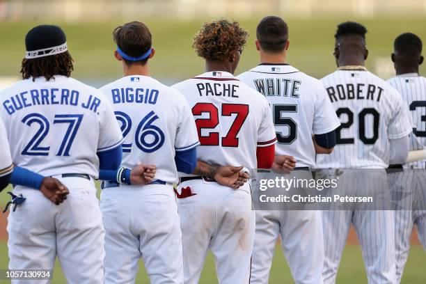 West All-Star, Cristian Pache of the Atlanta Braves tstands attended for the national anthem with teammates before the Arizona Fall League All Star...