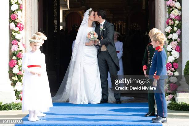 Duchess Sophie of Wurtemberg and Count Maximilien of Andigne get out of the Saint-Quirin church after their wedding at the Castle of Tegernsee on...