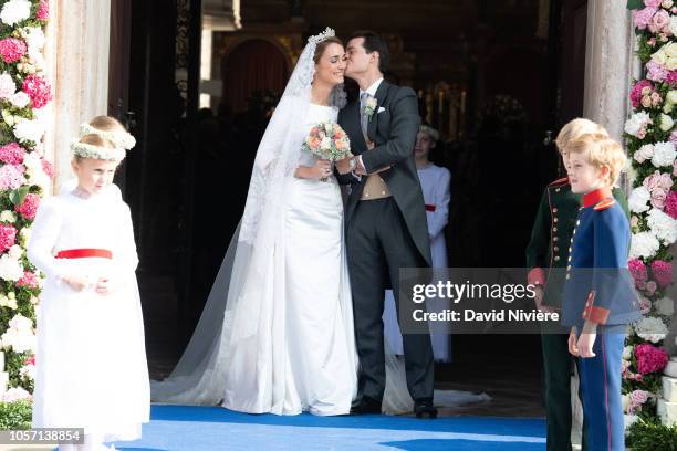 Duchess Sophie of Wurtemberg and Count Maximilien of Andigne get out of the Saint-Quirin church after their wedding at the Castle of Tegernsee on...