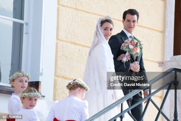 Duchess Sophie of Wurtemberg and Count Maximilien of Andigne get out of the Saint-Quirin church after their wedding at the Castle of Tegernsee on...