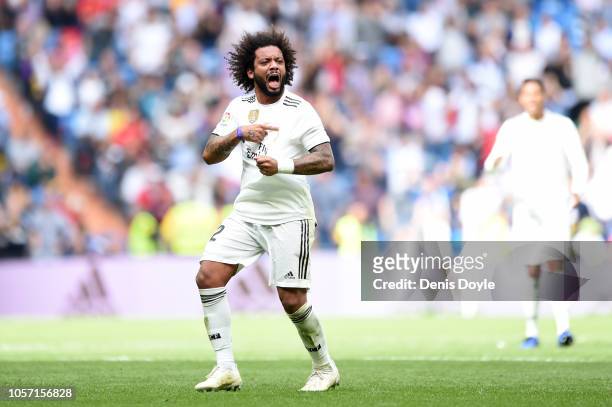 Marcelo of Real Madrid celebrates after scoring his sides first goal during the La Liga match between Real Madrid CF and Levante UD at Estadio...