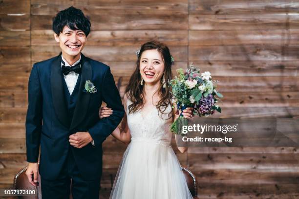 portrait of couple during their wedding - men in wedding dresses stock pictures, royalty-free photos & images