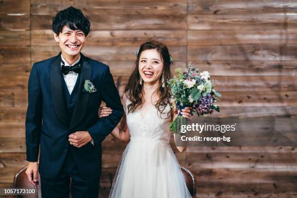 portrait of couple during their wedding - asian bride stock pictures, royalty-free photos & images