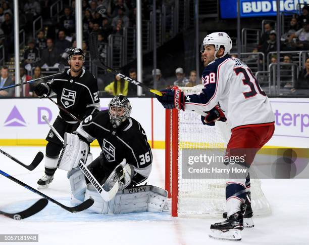 Jack Campbell of the Los Angeles Kings makes a save as Boone Jenner of the Columbus Blue Jackets looks for the rebond during the third period in a...