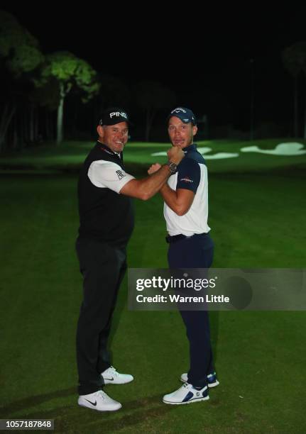 Lee Westwood and Danny Willett of England take part in a 14 club challenge under floodlights ahead of the Turkish Airlines Open at the Regnum Carya...