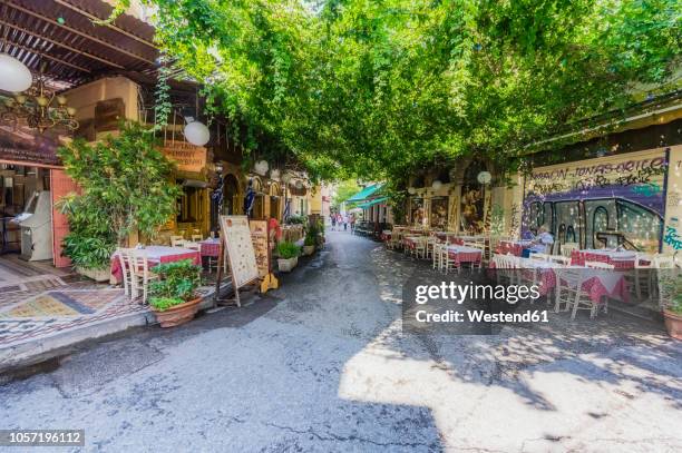 greece, athens, road with restaurants - athens restaurant stock pictures, royalty-free photos & images
