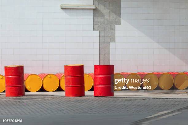 morocco, row of oil drums - oil drum stock pictures, royalty-free photos & images