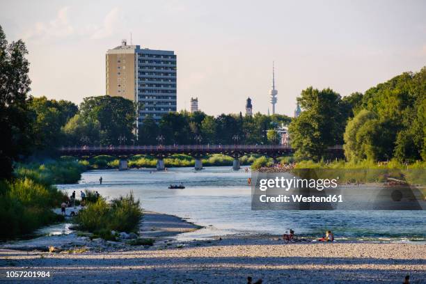 germany, munich, view of the flaucher with tv tower in background - isar münchen stock-fotos und bilder