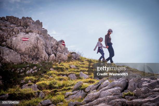 austria, salzburg state, loferer steinberge, mother and daughter on a hiking trip in the mountains - austria flag stock pictures, royalty-free photos & images