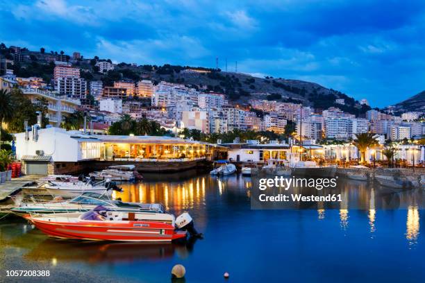 albania, vlore county, saranda, fishing harbour in the evening - albanian stock pictures, royalty-free photos & images