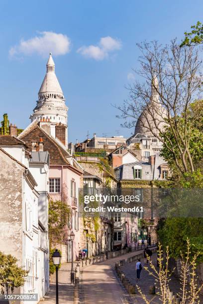 france, paris, montmartre, place dalida, rue de l'abreuvoir, alley - montmartre stock pictures, royalty-free photos & images