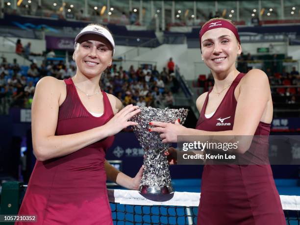 Lyudmyla Kichenok of Ukraine and Nadiia kichenok of Ukraine pose with their trophy after defeating Lidziya Marozava of Belarus and Shuko Aoyama of...