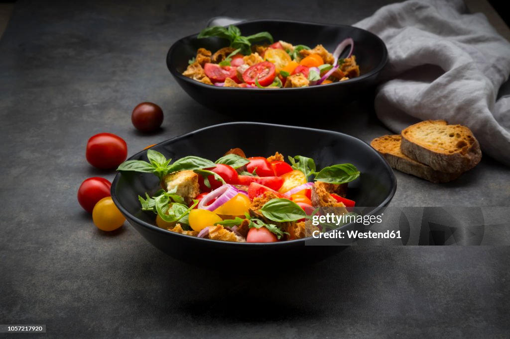 Panzanella made of roasted Ciabatta, rocket, red onions, tomatoes and basil