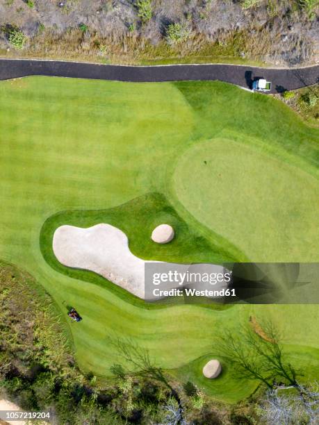 indonesia, bali, aerial view of golf course - bali golf stock pictures, royalty-free photos & images