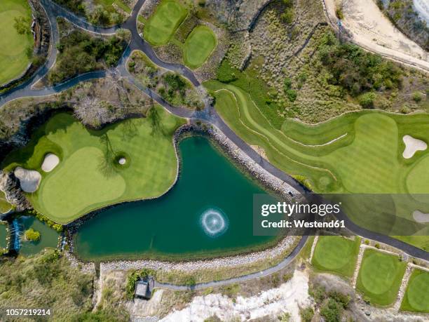 indonesia, bali, golf course at payung beach - lakeside stadium stock pictures, royalty-free photos & images