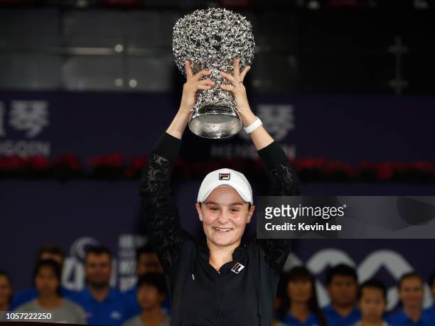 Ashleigh Barty of Australia poses with her trophy after defeating Wang Qiang of China in the Women's Single final match on Day 6 of 2018 WTA Elite...