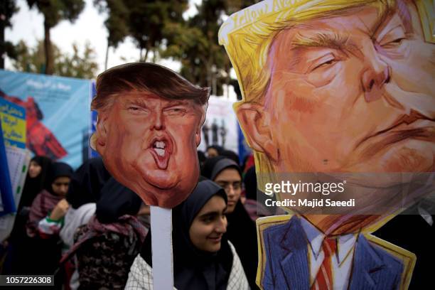 On the eve of renewed sanctions by Washington, Iranian protesters demonstate outside the former US embassy in the Iranian capital Tehran on November...