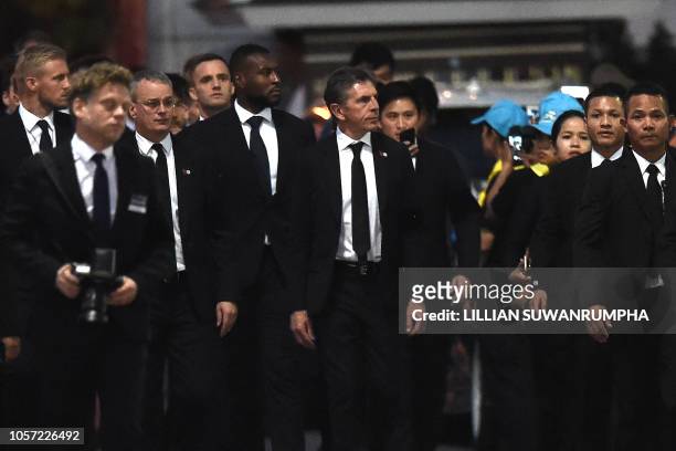 Leicester City's manager Claude Puel and players arrive at Wat Thepsirin Buddhist temple in Bangkok on the second day of funeral ceremony for...