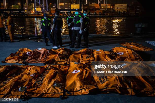 Body bags containing remains of passengers from Lion Air flight JT 610 are laid out at the Tanjung Priok port on November 4, 2018 in Jakarta,...