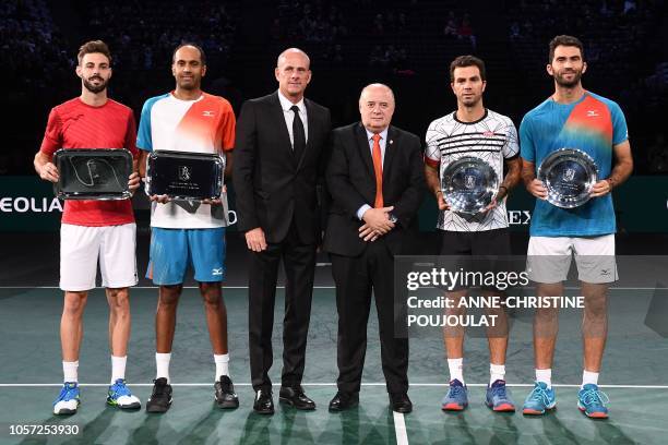 Winners Spain's Marcel Granollers and Rajeev Ram of the US , second placed Netherlands' Jean-Julien Rojer and Romania's Horia Tecau pose with their...