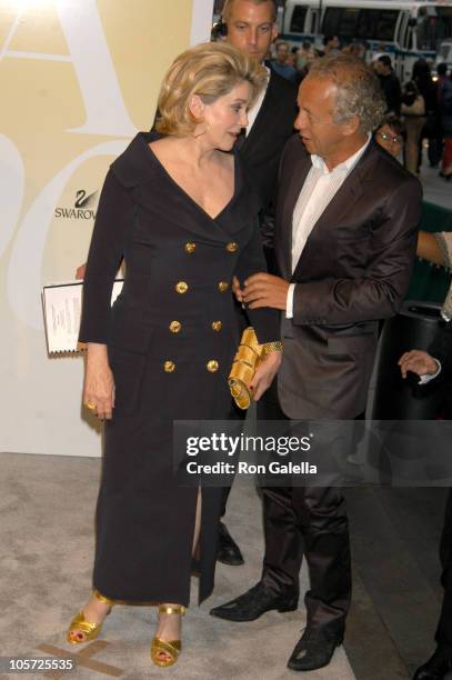 Catherine Deneuve and Gilles Bensimon, publication director of ELLE Magazine and recipient Eugenia Sheppard Award