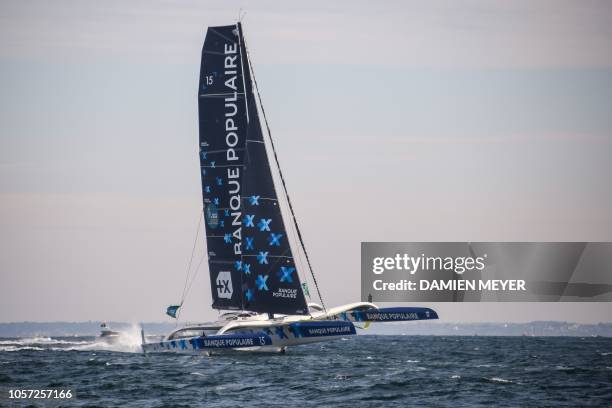 French skipper Armel Le Cleac'h's Ultim maxi-trimarans Banque Populaire IX sails off the coast of Saint-Malo on November 4, 2018 moments after taking...