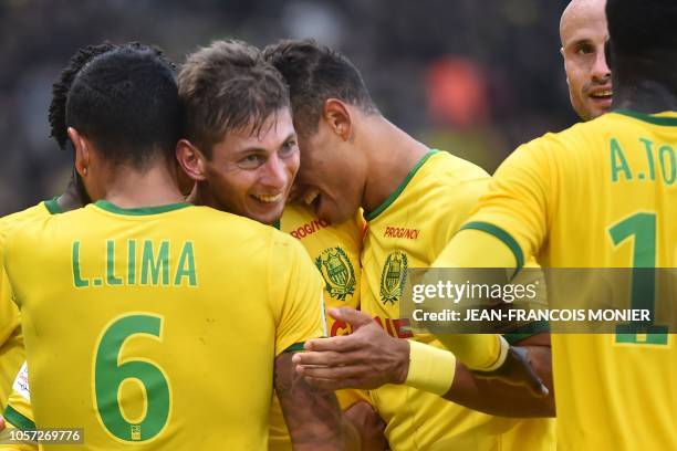 Nantes' Argentinian forward Emiliano Sala celebrates with teammates after scoring a goal during the French L1 football match between Nantes and...