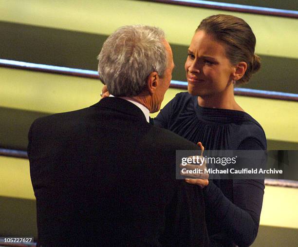 Clint Eastwood, winner Best Picture for "Million Dollar Baby", hugs Hilary Swank, winner Best Actress in a Leading Role for "Million Dollar Baby"