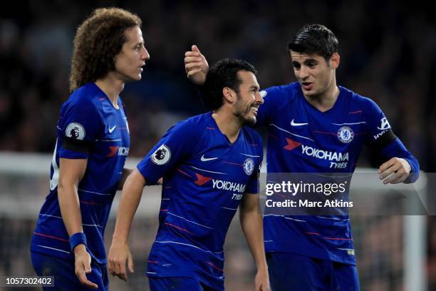 Pedro of Chelsea celebrates with Alvaro Morata and David Luiz during the Premier League match between Chelsea FC and Crystal Palace at Stamford...