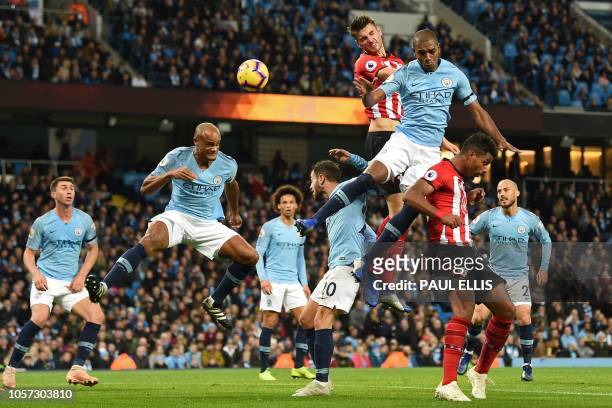 Southampton's Dutch defender Wesley Hoedt jumps for the ball with Manchester City's Brazilian midfielder Fernandinho during the English Premier...