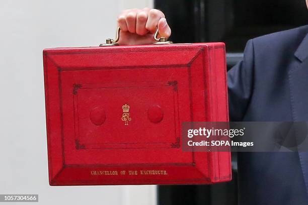 Chancellor of the Exchequer, Philip Hammond seen holding a famous red box on the steps of Number 11 Downing street, before leaving for the Palace of...