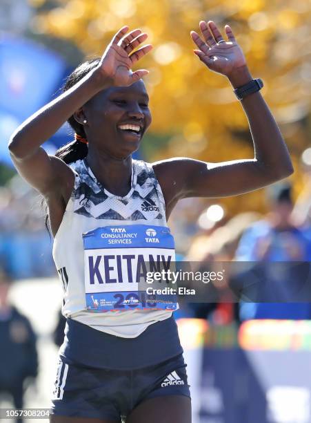 Mary Keitany of Kenya celebrates her first place win in the Women's Division at the finish line during the 2018 TCS New York City Marathon on...