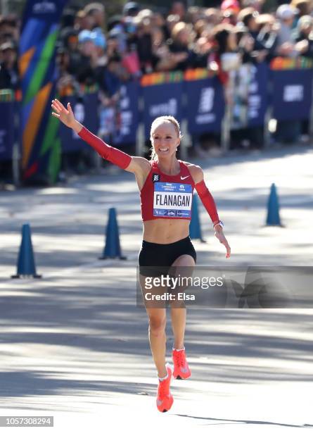Shalane Flanagan of the USA celebrates her third place finish in the Women's Division as she crosses the finish line during the 2018 TCS New York...