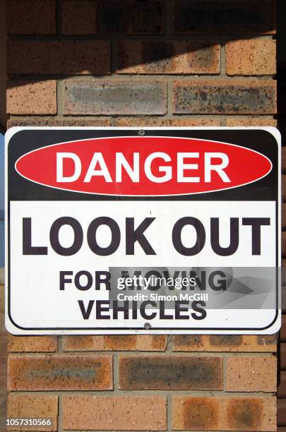 'danger: look out for moving vehicles' sign - car crash wall stock pictures, royalty-free photos & images