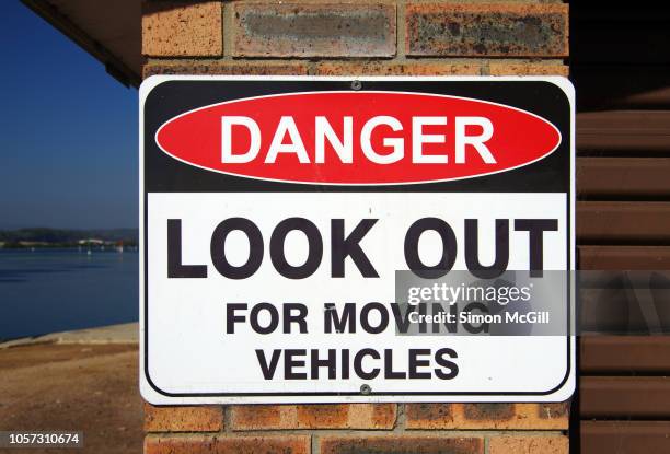 'danger: look out for moving vehicles' sign - car crash wall stock pictures, royalty-free photos & images