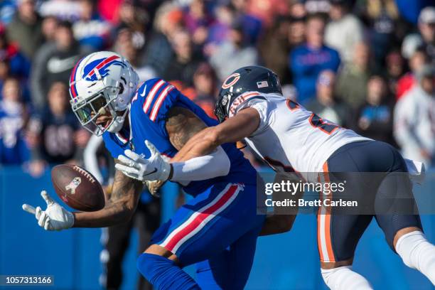 Terrelle Pryor of the Buffalo Bills bobbles a pass as he is tackled by Kyle Fuller of the Chicago Bears, Adrian Amos , intercepted the pass during...