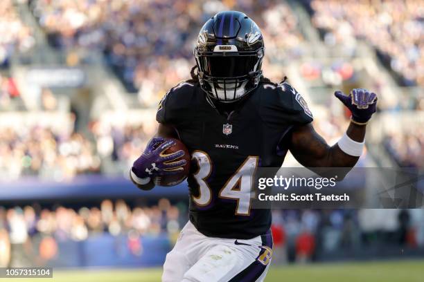 Running Back Alex Collins of the Baltimore Ravens rushes for a touchdown in the third quarter against the Pittsburgh Steelers at M&T Bank Stadium on...