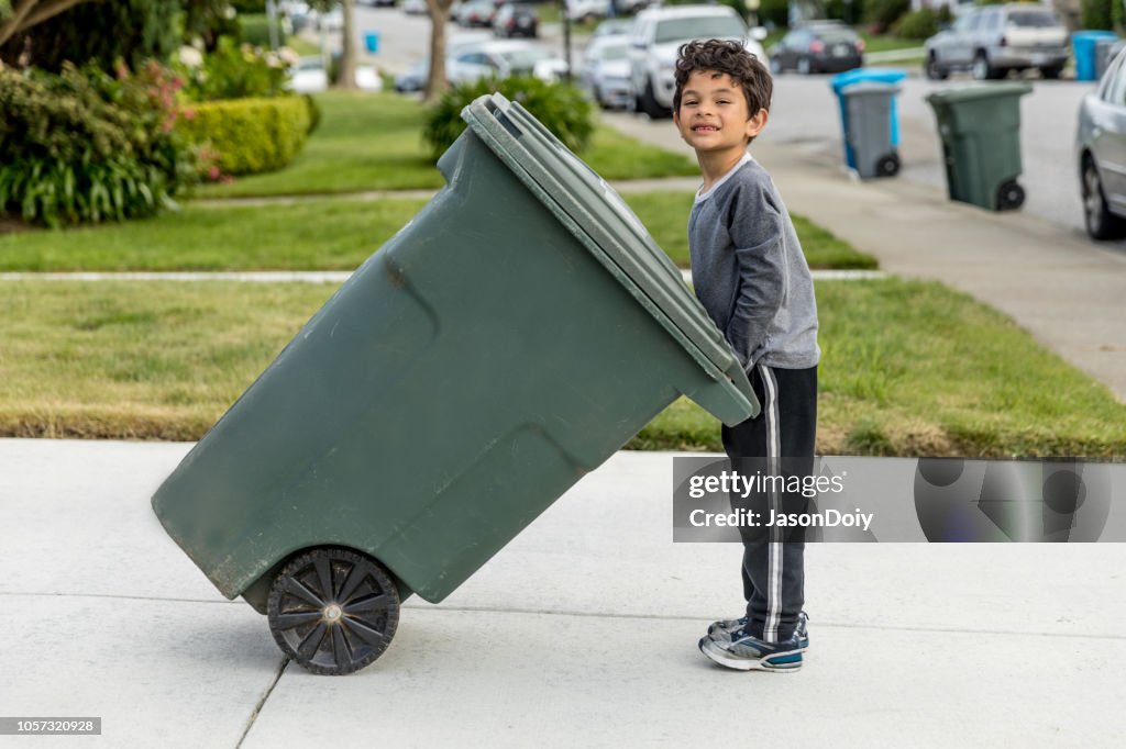 Boy Taking out Trash