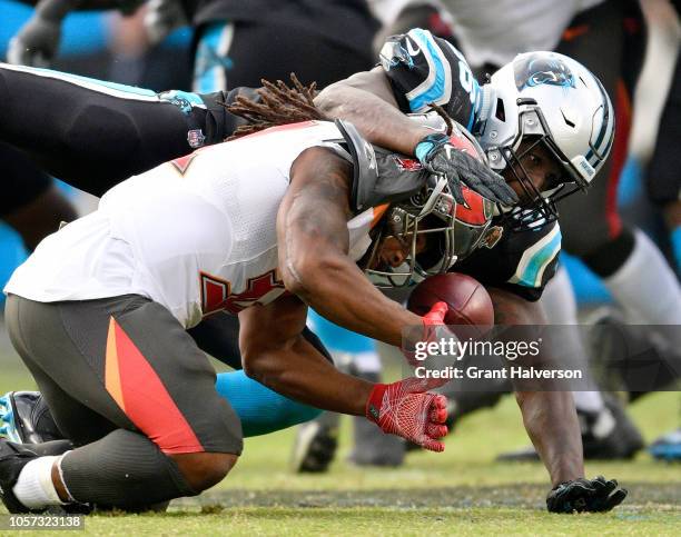 Thomas Davis of the Carolina Panthers breaks up a pass intended for Jacquizz Rodgers of the Tampa Bay Buccaneers during the fourth quarter of their...