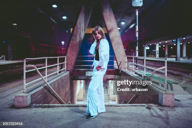 young woman on train station - 15 year old model stock pictures, royalty-free photos & images