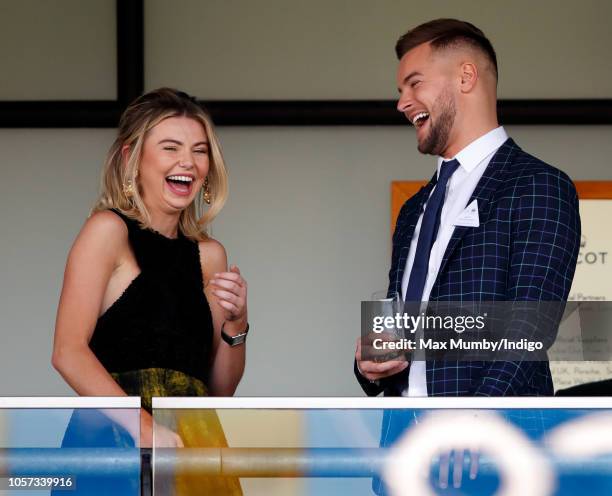 Georgia Toffolo and Chris Hughes watch the racing during the QIPCO British Champions Day at Ascot Racecourse on October 20, 2018 in Ascot, United...