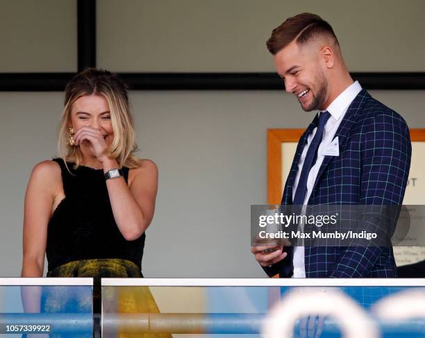 Georgia Toffolo and Chris Hughes watch the racing during the QIPCO British Champions Day at Ascot Racecourse on October 20, 2018 in Ascot, United...