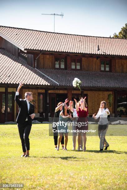 throwing the bouquet at the gay wedding - catching bouquet stock pictures, royalty-free photos & images