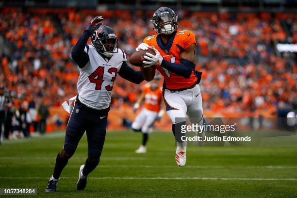 Wide receiver Courtland Sutton of the Denver Broncos nearly has a touchdown catch before dropping the ball under coverage by defensive back Shareece...