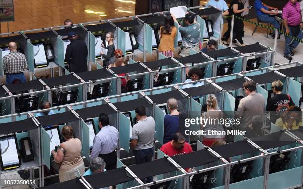 People vote on the first day of early voting at the Meadows Mall on October 20, 2018 in Las Vegas, Nevada. Early voting for the midterm elections in...