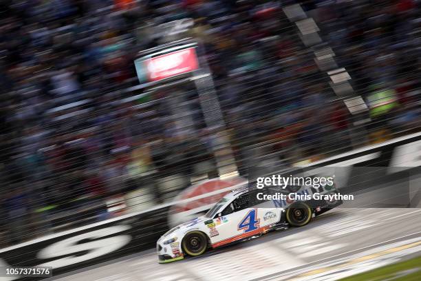 Kevin Harvick, driver of the Mobil 1 Ford, crosses the finish line to win the Monster Energy NASCAR Cup Series AAA Texas 500 at Texas Motor Speedway...