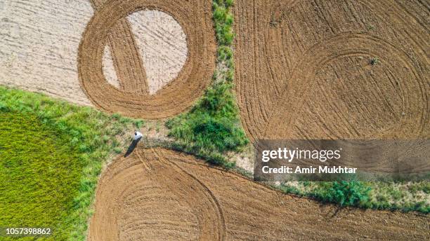 aerial view of ploughed fields in red soil - punjab aerial view imagens e fotografias de stock