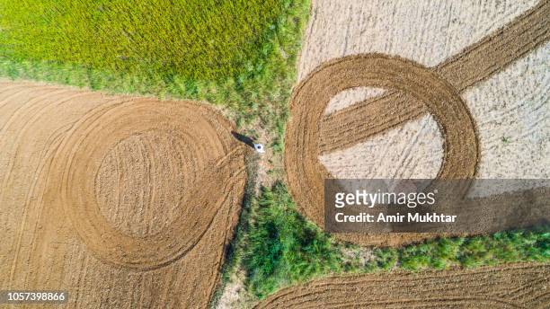 aerial view of ploughed fields in red soil - punjab aerial view stock pictures, royalty-free photos & images