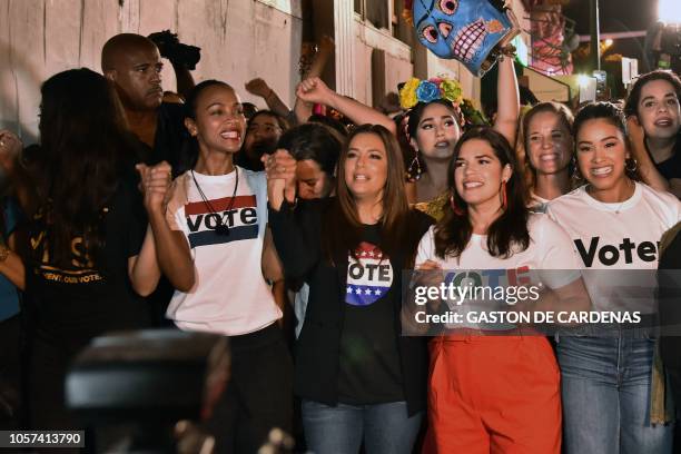 Actresses and activists Rosario Dawson, Zoe Saldana, Eva Longoria, America Ferrera and Gina Rodriguez march down Calle Ocho during "Latinas en...